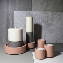 Load image into Gallery viewer, Concrete and Wax Hand Poured Soy Wax candle Trio Tealight Candle Holder Set Blush Pink and grey Lifestyle shot
