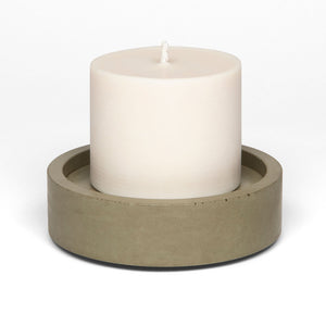 concrete and wax hand poured vegan soy large candle on a olive concrete plate holder
