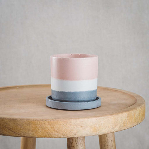 cord&iron concrete plant pot with charcoal grey plate tray in layered colours of pink white & charcoal