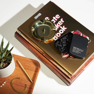 Square Trade Goods Company Incense Cones in Black Tin Roaring Pines Scent Lifestyle Shot